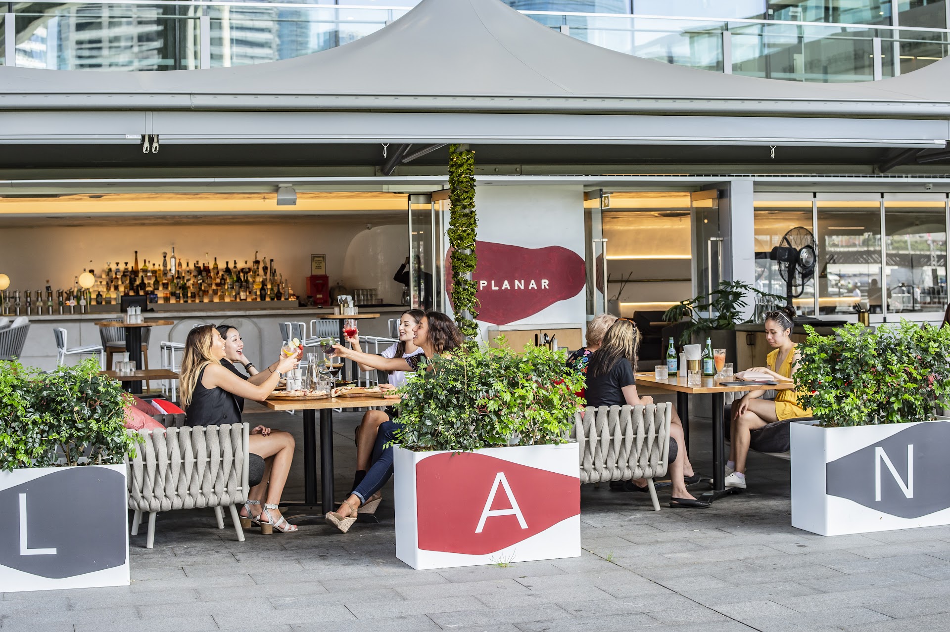 Planar Restaurant alfresco frontage with guests and bar seating