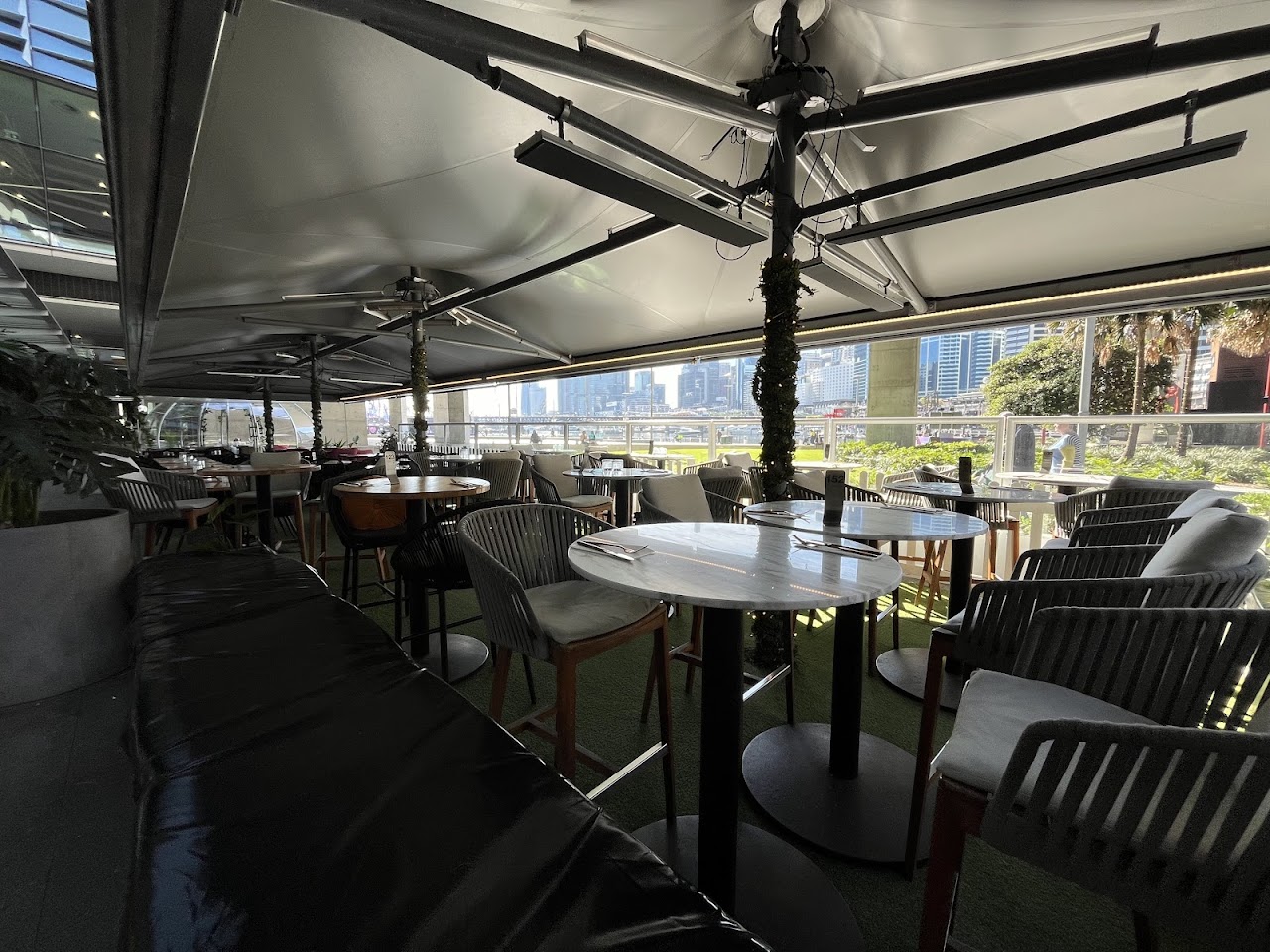Harbour-facing covered seating at Planar Restaurant